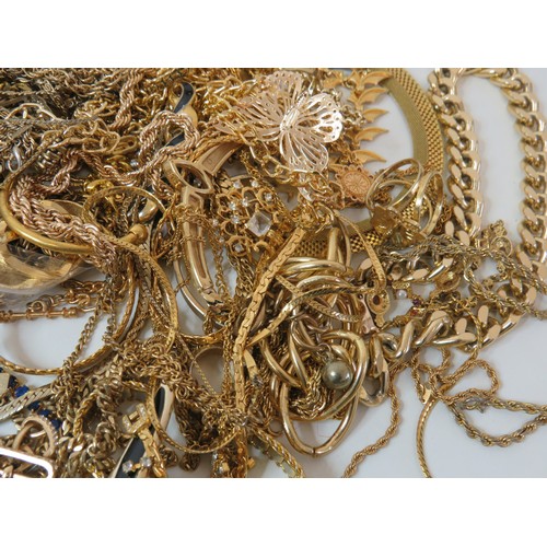 77 - 2kg of gold tone costume jewellery.