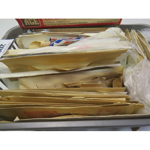 209 - 100's of old stamps in envelopes