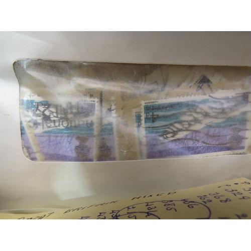 209 - 100's of old stamps in envelopes