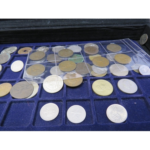 Assortment of coins in metal carry case