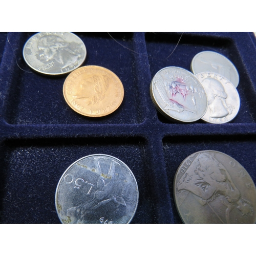 Assortment of coins in metal carry case