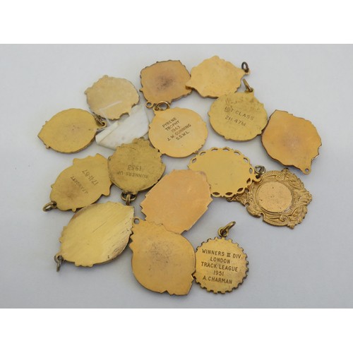 90 - Collection of gold tone medals and fobs.