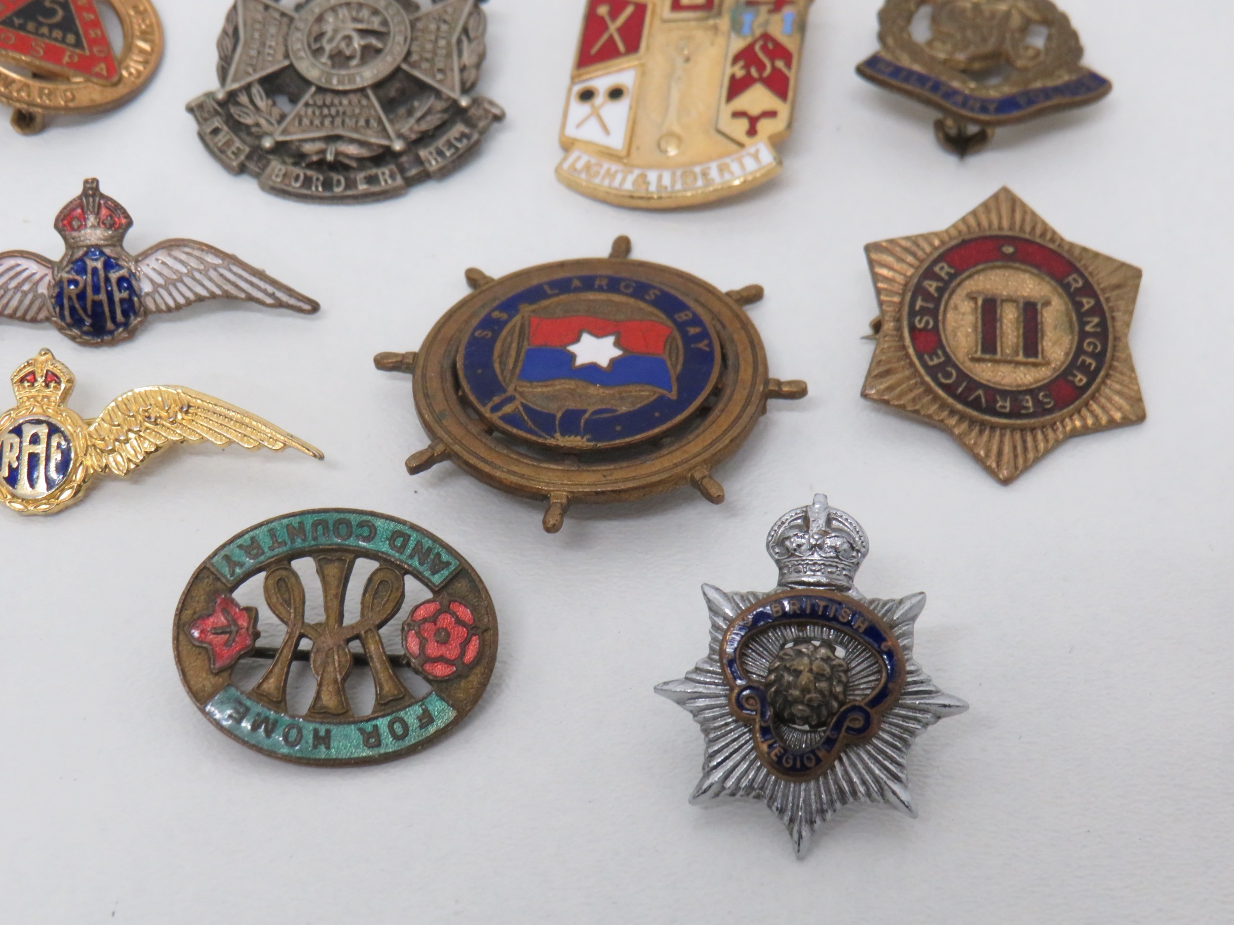 Lot of assorted badges including military