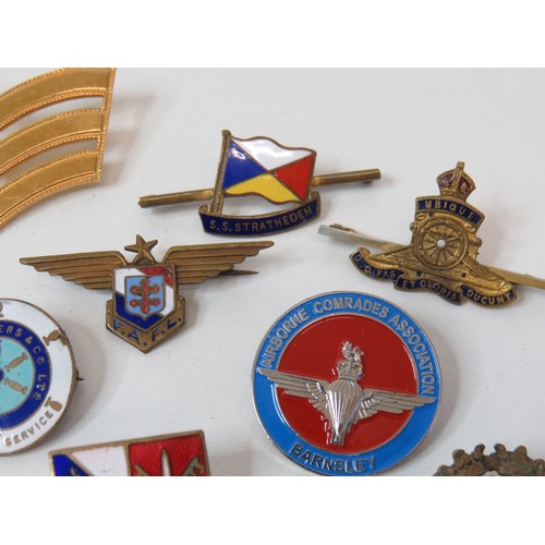 Fifteen assorted pin badges including military