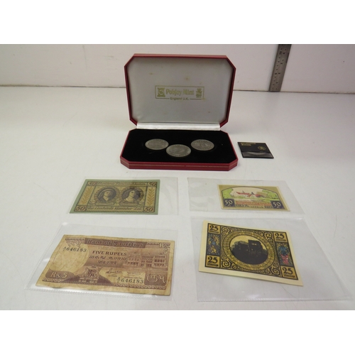 Red mint case and contents including coins and notes
