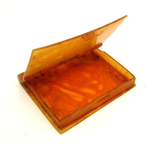 61B - Art Deco amber celluloid card case in the style of a book.