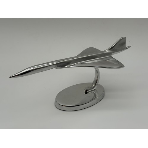 100G - Chrome medium size concorde on stand