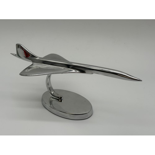 100G - Chrome medium size concorde on stand