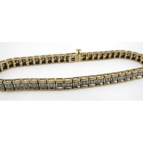 75B - A 9ct yellow gold tennis bracelet set with 2ct of Princess cut square Diamonds.
Weight 14.8g
Length ... 