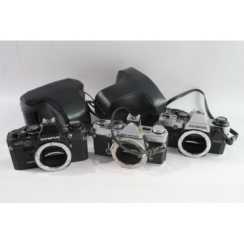 28 - Olympus SLR Film Cameras Working Inc OM-1N & OM10 Etc Bodies Only x 3