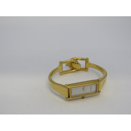 115 - Gold tone Gucci watch