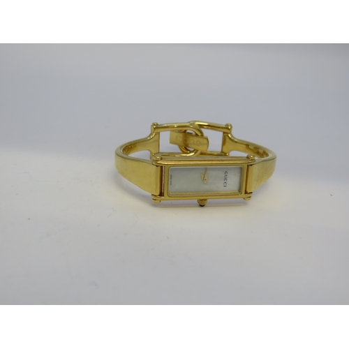 115 - Gold tone Gucci watch
