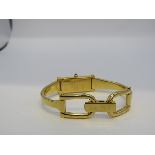 115 - Gold tone Gucci watch