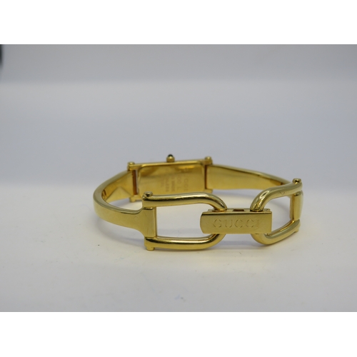 115 - Gold tone Gucci watch