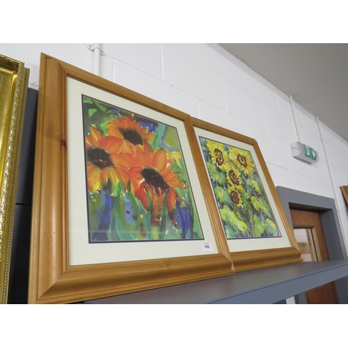102 - Two wooden framed Sunflowers signed paintings