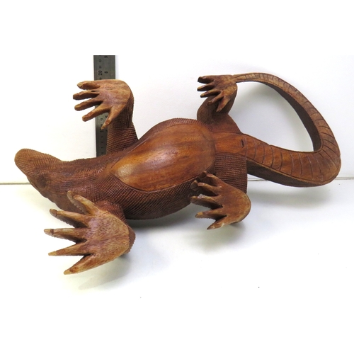 12 - A large hand carved wooden sculpture of a Komodo Dragon.