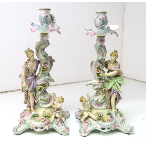 32 - A pair of 19th century Dresden porcelain figural candlesticks.