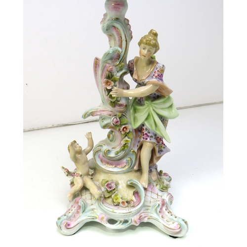 32 - A pair of 19th century Dresden porcelain figural candlesticks.