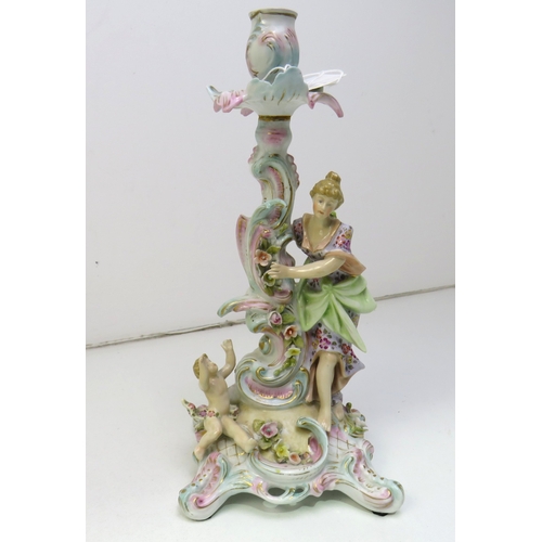 32 - A pair of 19th century Dresden porcelain figural candlesticks.