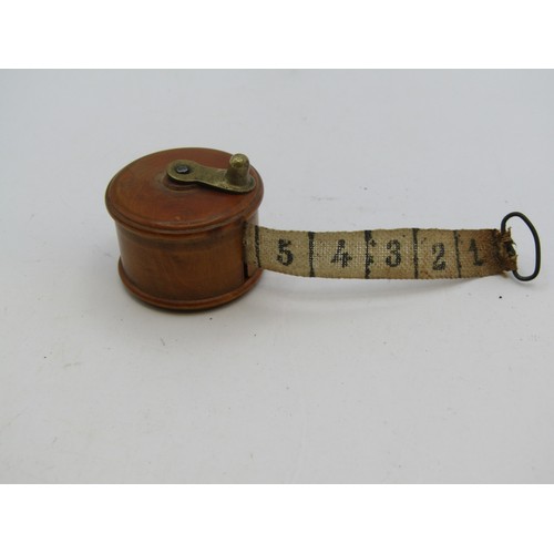 137 - Treen measuring tape