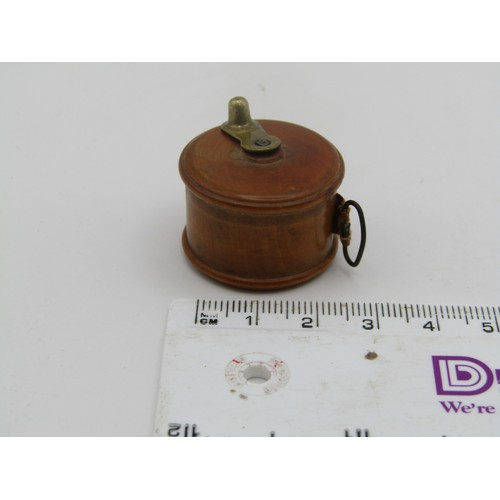 137 - Treen measuring tape