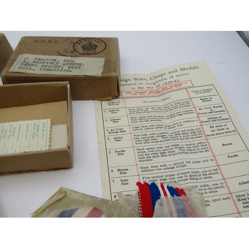 A collection of WW2 medals and packets.