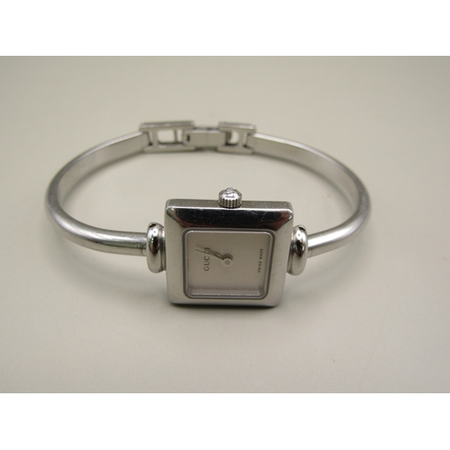 8 - Ladies Gucci bangle watch.
