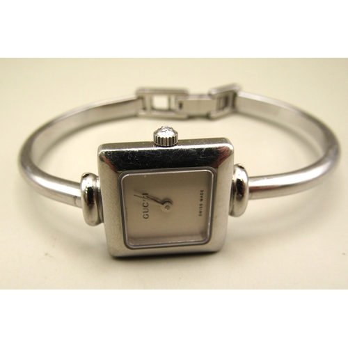8 - Ladies Gucci bangle watch.