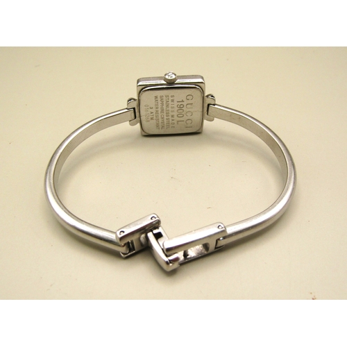 8 - Ladies Gucci bangle watch.