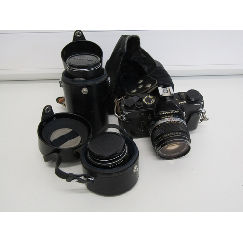 17 - Vintage Olympus OM-1 film camera with lens.