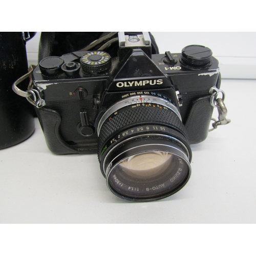 17 - Vintage Olympus OM-1 film camera with lens.