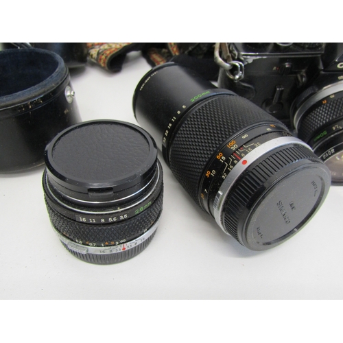 17 - Vintage Olympus OM-1 film camera with lens.