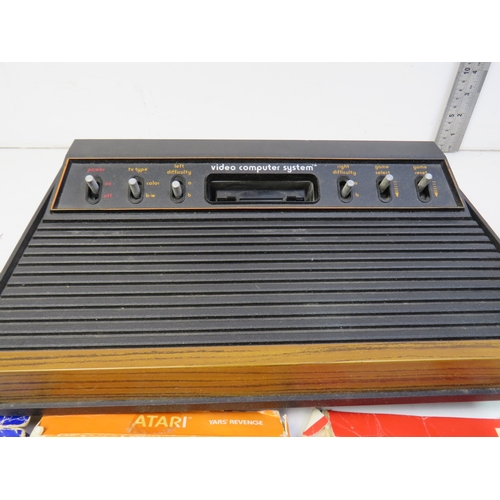 385 - Atari Video computer system and games, including Space invaders, Yar's revenge and Combat