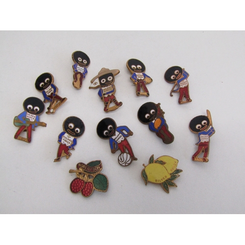 36 - A collection of vintage Robertsons golly and fruit badges.