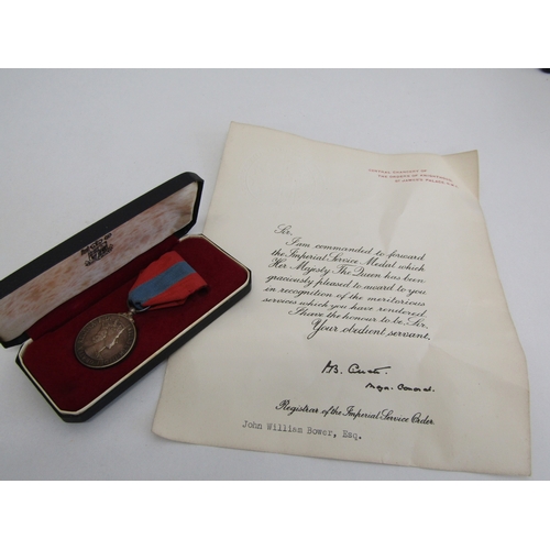 24 - Boxed Imperial Service medal with paperwork to John William Bower.