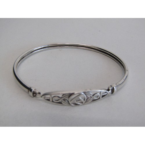 46 - 3 925% Silver hall marked items. A large locket, St Christopher, a Celtic designed braclet.