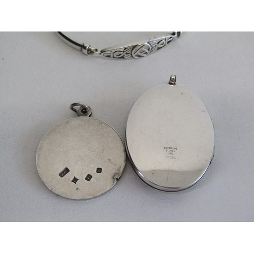 46 - 3 925% Silver hall marked items. A large locket, St Christopher, a Celtic designed braclet.