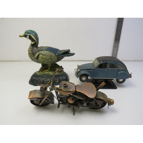 292 - Cast iron duck doorstop, metal model motorbike and car.
