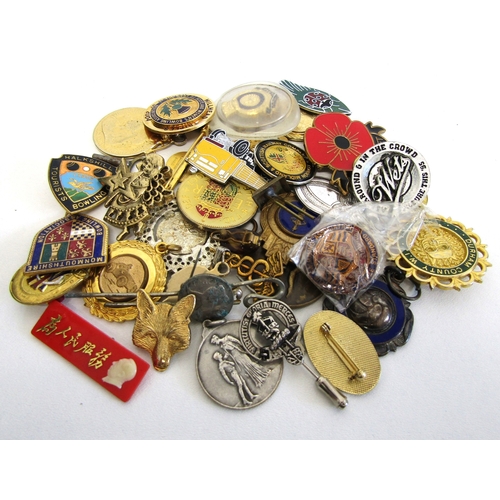 70 - A collection of mixed badges, pins and fobs.