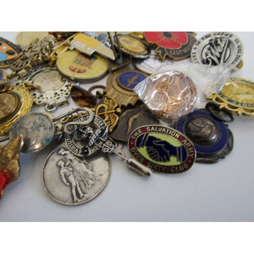 70 - A collection of mixed badges, pins and fobs.