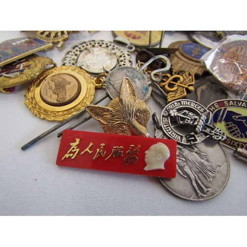 70 - A collection of mixed badges, pins and fobs.