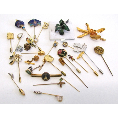 69 - A collection of vintage stick pins, hat pins and tie clips.