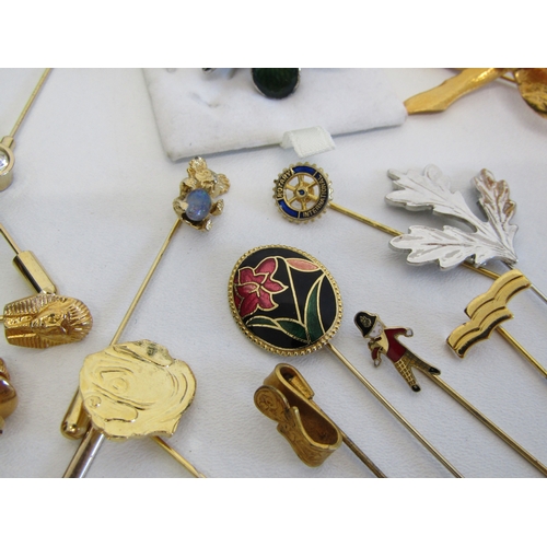69 - A collection of vintage stick pins, hat pins and tie clips.