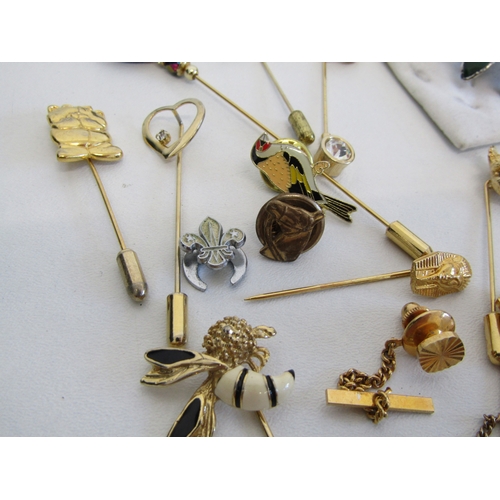69 - A collection of vintage stick pins, hat pins and tie clips.