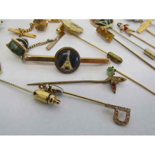 69 - A collection of vintage stick pins, hat pins and tie clips.