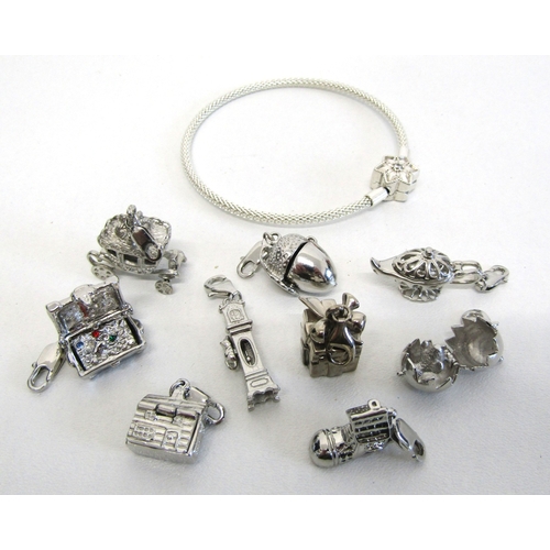 77 - Genuine Pandora bracelet and a collection of nine silver charms including opening.