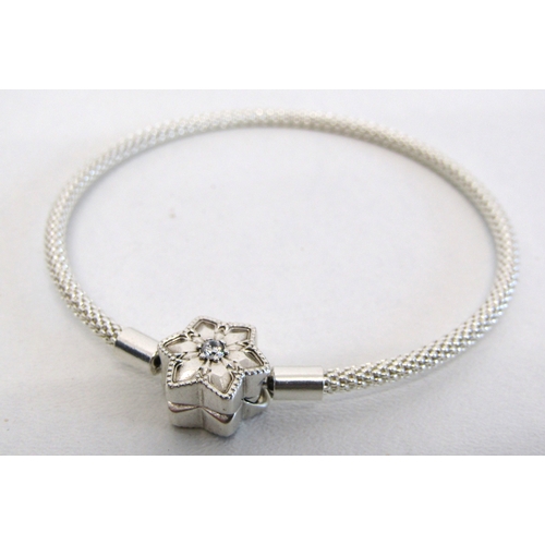 77 - Genuine Pandora bracelet and a collection of nine silver charms including opening.