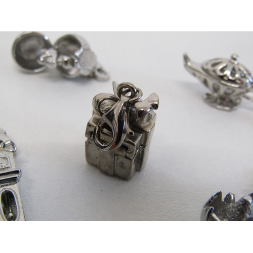 77 - Genuine Pandora bracelet and a collection of nine silver charms including opening.