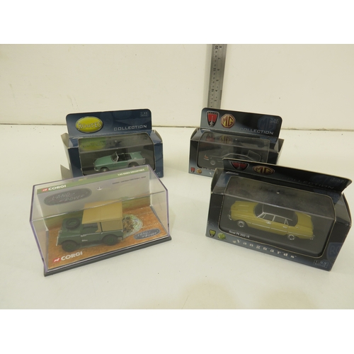 285 - Seven boxed diecast model cars.