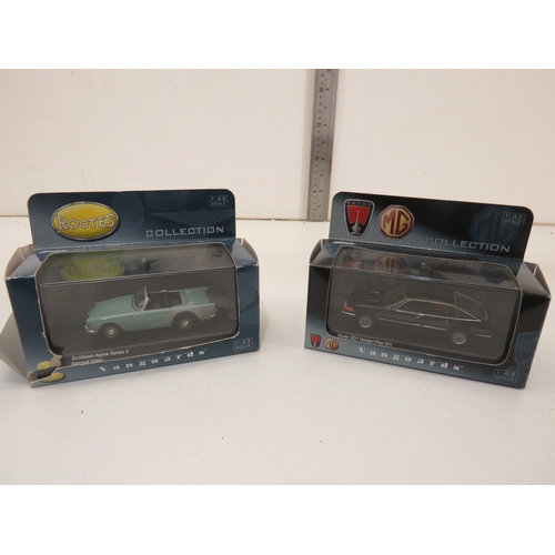 285 - Seven boxed diecast model cars.